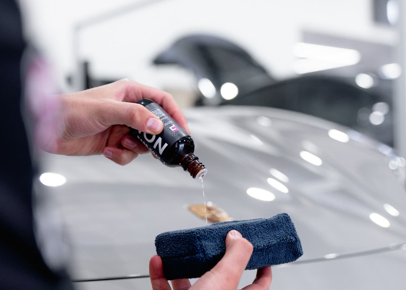 Ceramic Pro ION coating poured onto an applicator pad